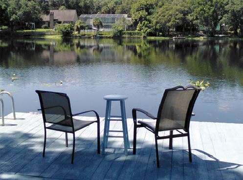 two-chairs-overlooking-a-pond